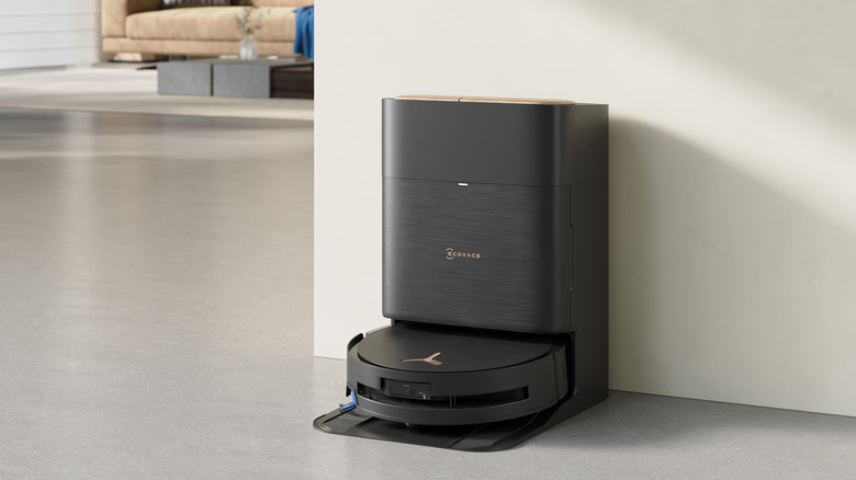 A black ECOVACS DEEBOT X9 PRO OMNI docked in a room
