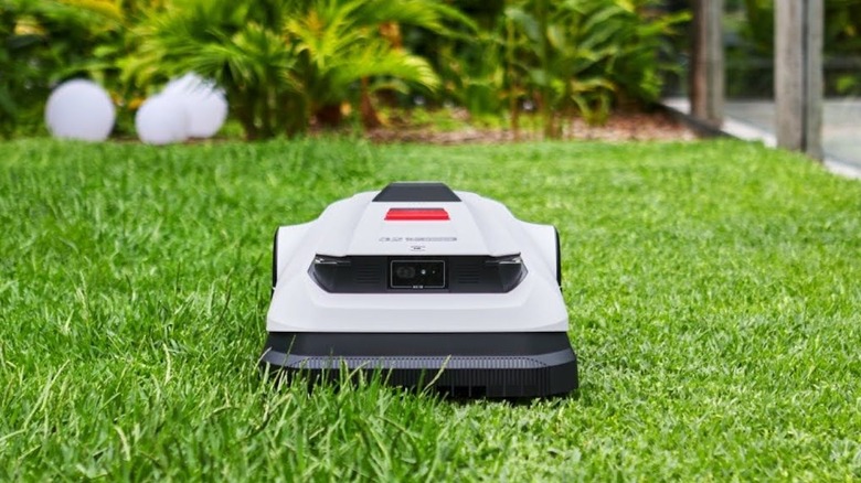 The ECOVACS A2500 RTK mowing a lawn.