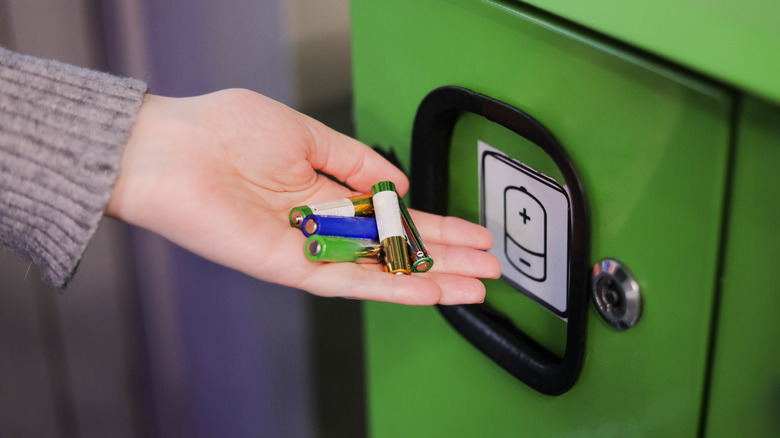 Batteries being recycled in green bin