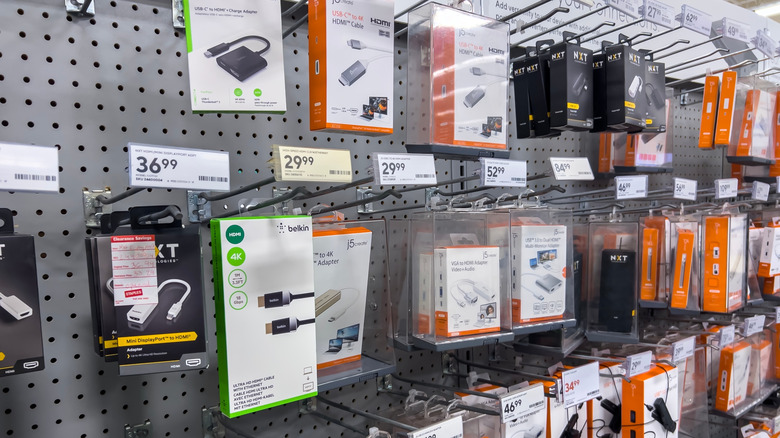 A variety of tech accessories inside a Staples, prominently featuring NXT devices