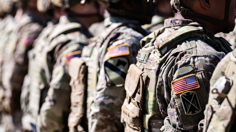 American soldiers lined up showing American flag on the uniform