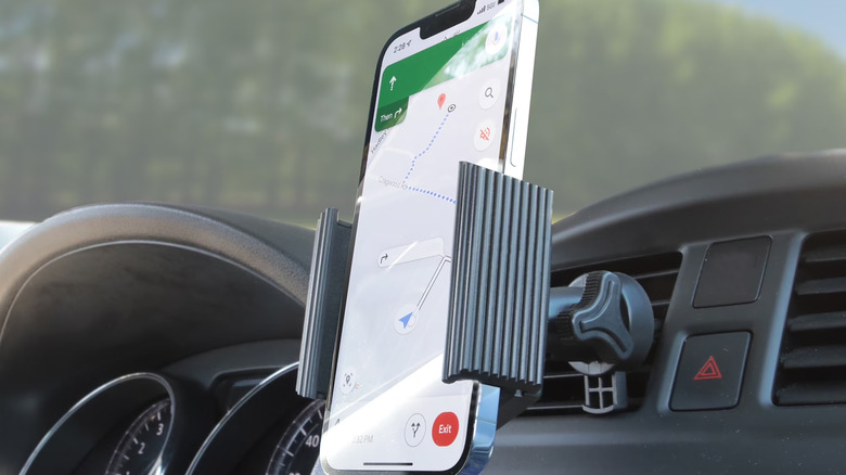Apple iPhone inside of an Onn vent mount in a car.
