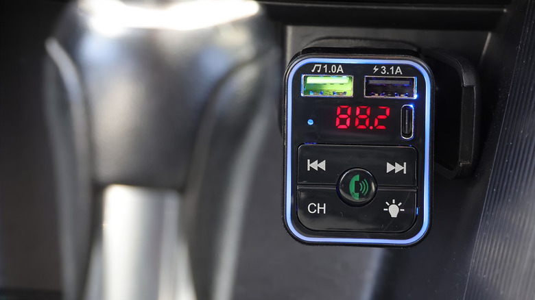Onn Bluetooth FM Car Charger inside of a car's auxiliary power outlet.
