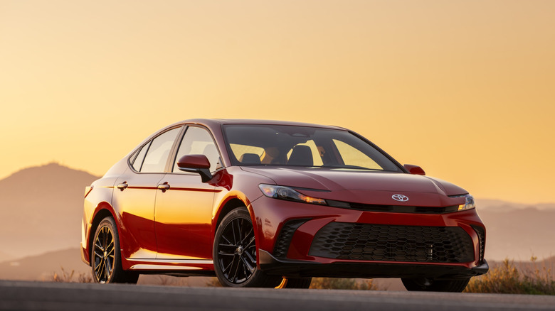 2026 Toyota Camry parked with sunset backdrop, front-right 3/4 view