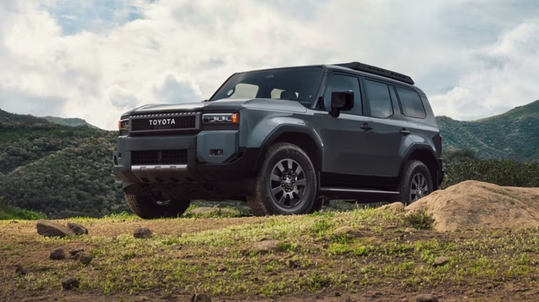 A Toyota Land Cruiser on a hill outside.