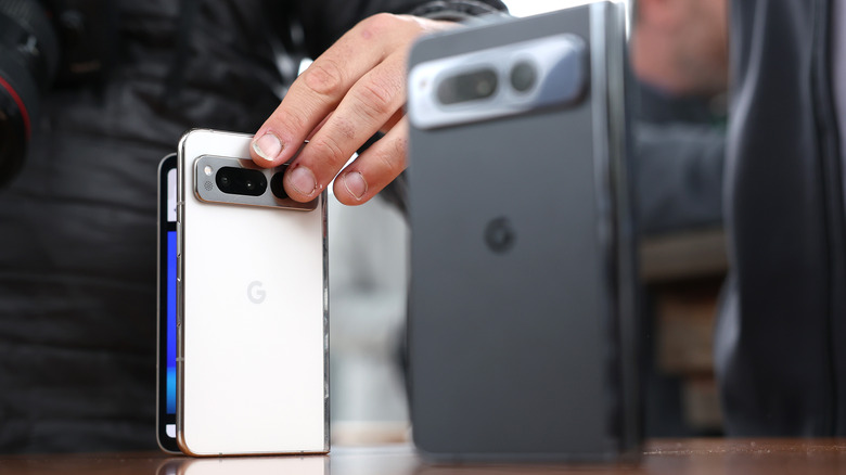 A member of the media inspects the new Google Pixel Fold