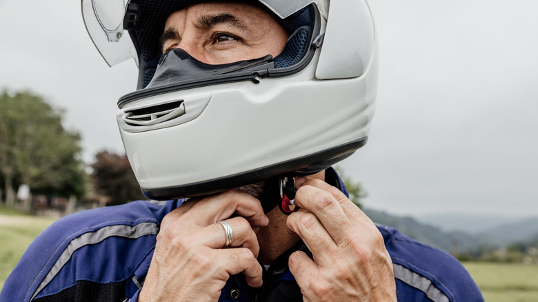 A motorcyclist properly wearing his helmet