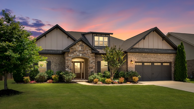 Suburban home with interior lights on