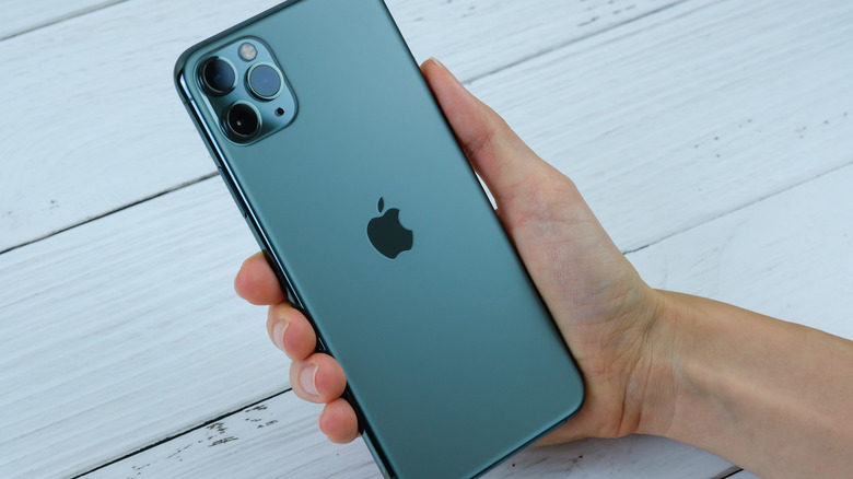 Hand holding an iPhone