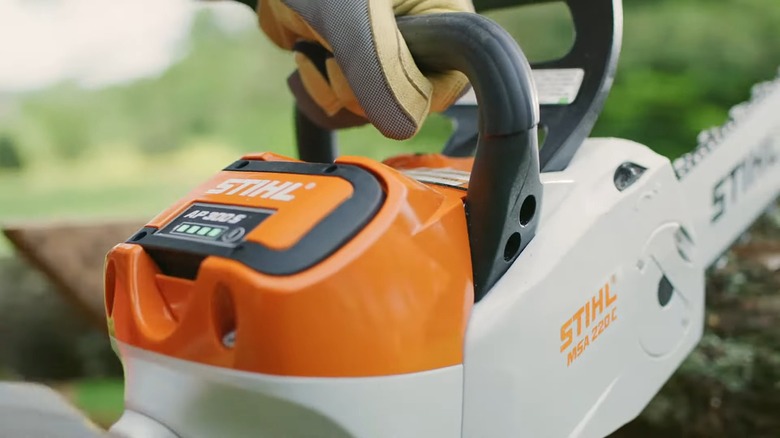 A Stihl 300 S Lithium-Ion battery in a chainsaw