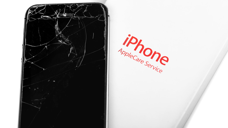 cracked iPhone next to AppleCare logo