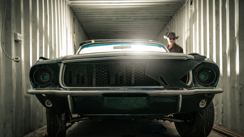 Vintage car inside a shipping container