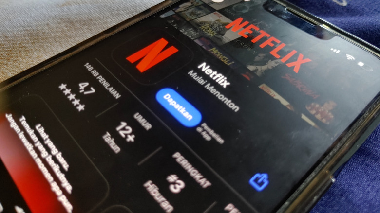 A phone displaying Netflix on its screen