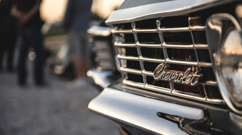 Close-up of Chevrolet script logo on a car grille