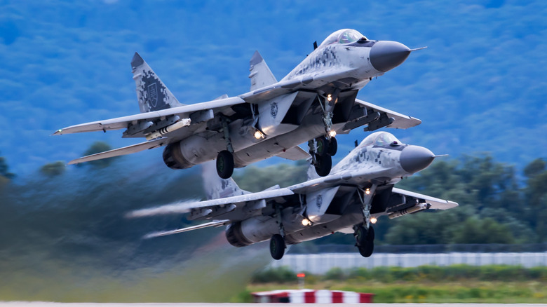 A two plane formation of MiG-29s at takeoff