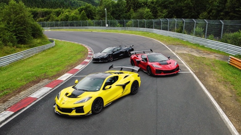Black, red, and yellow Corvette ZR1s stopped on Nurburgring track
