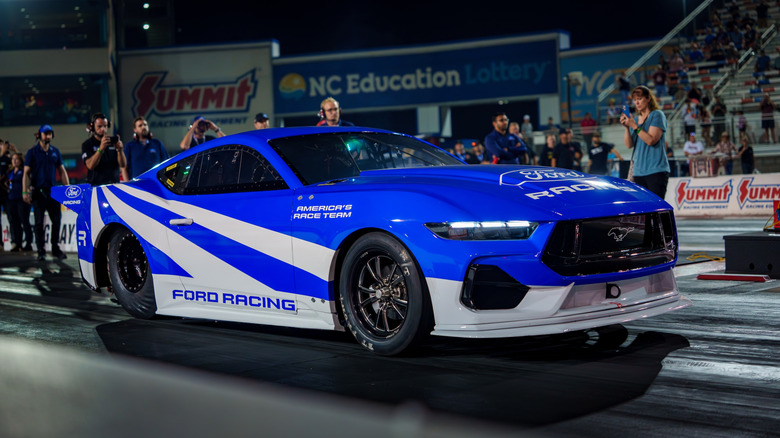 Ford Mustang Cobra Jet 2200 launching at the drag strip.