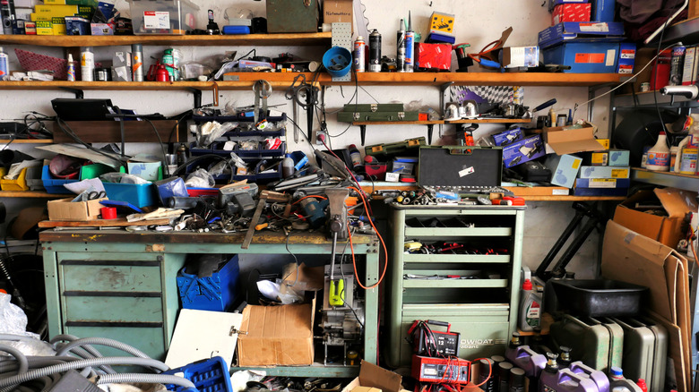 Cluttered garage with overflowing boxes