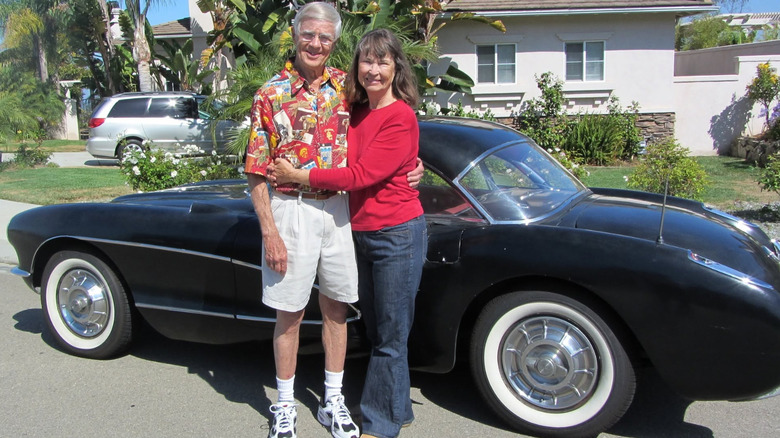 A shot of Bill Hatch, his wife, and their 1957 Chevrolet Corvette