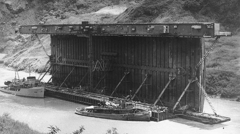 An AFDM-1-class floating drydock, on it side for Panama Canal passage