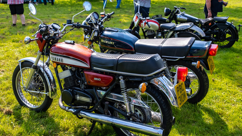 Classic 1974 Yamaha RD350 2 stroke motorcycle on display at an informal bike meet