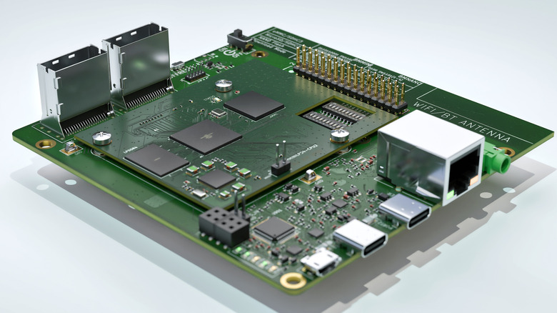 A two PCB computer with a variety of components and ports on a white background