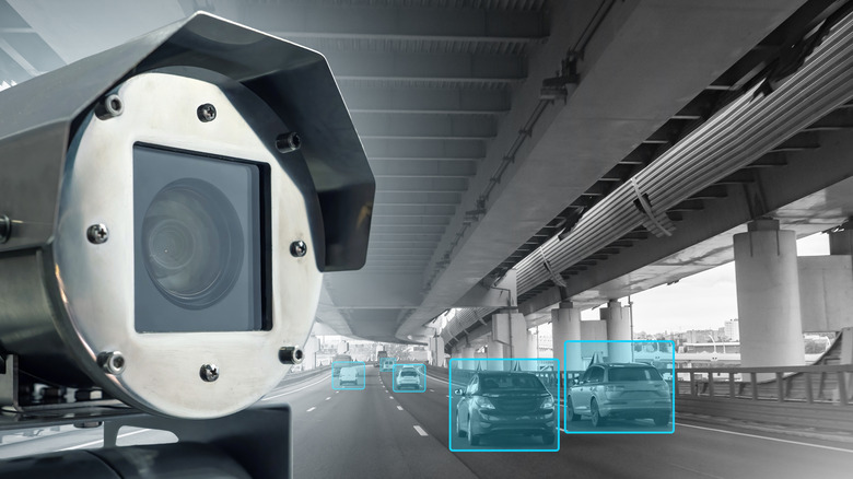 Traffic camera with passing traffic marked with blue boxes