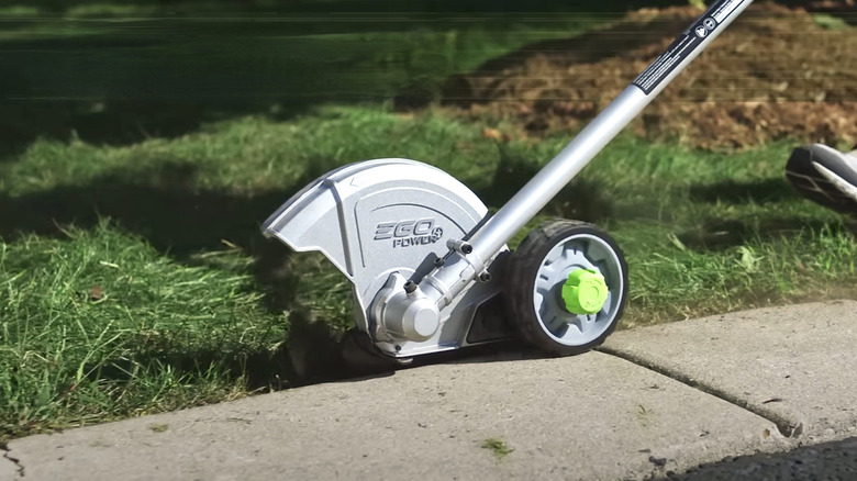 Person using EGO multi-head tool