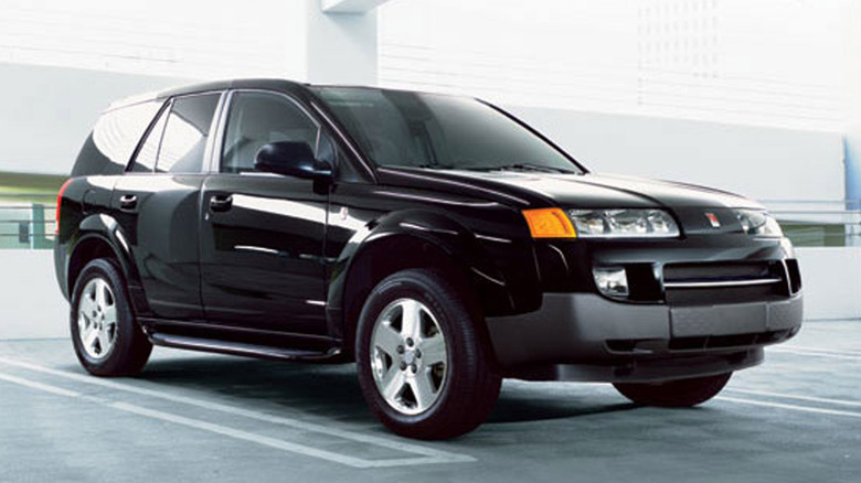 Black Saturn Vue parked in garage