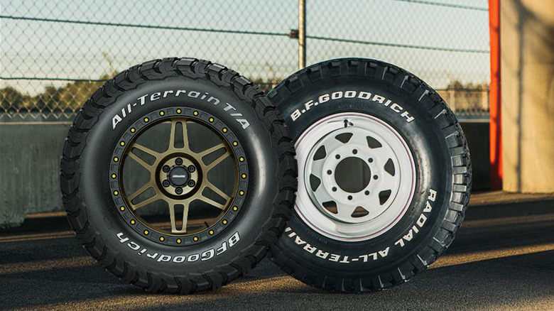 Side-by-side rendered photo of BFGoodrich All-Terrain T/A tires, modern KO3 on left and original model on right