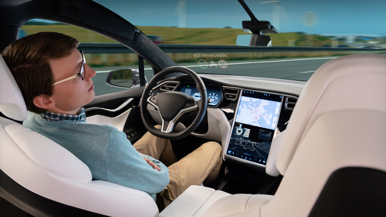 man sleeping while using Tesla Autopilot