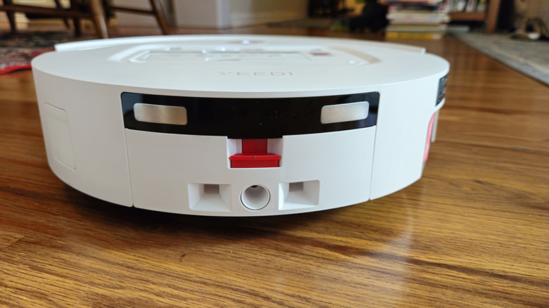 The back of the Yeedi M14 Plus in white on a hardwood floor