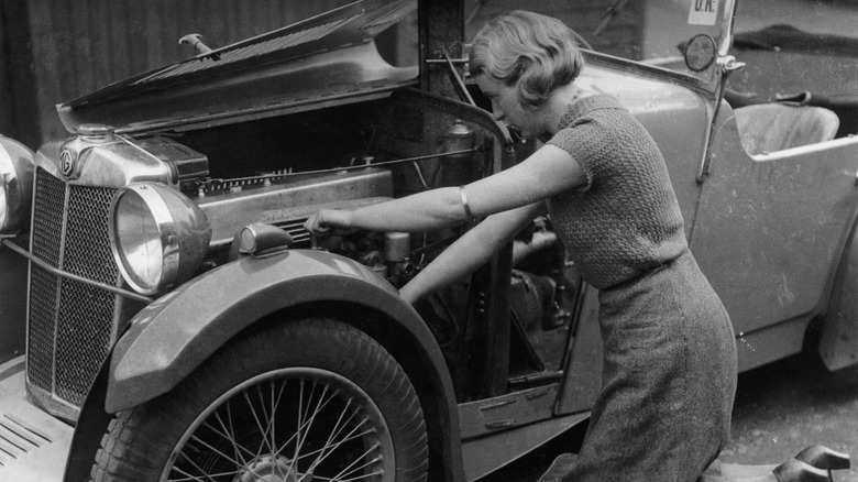 Kitty Brunell, winner of 1933 Rally of Great Britain, working on her MG F Magna