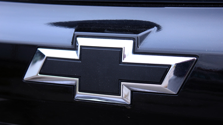 Close up of a Chevrolet logo on a black vehicle