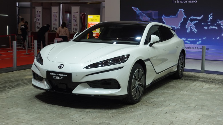 A front 3/4 shot of a white Denza Z9 GT on display at a car show.