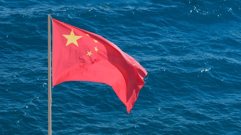 People's Republic of China flag flying over water