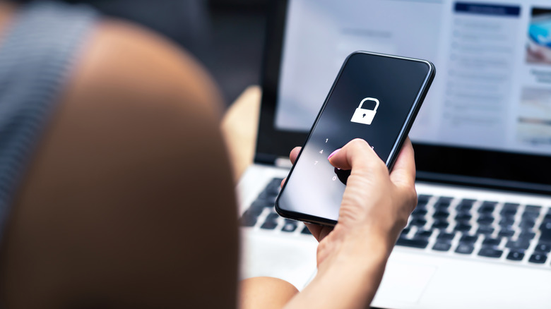 Locked smartphone in hand