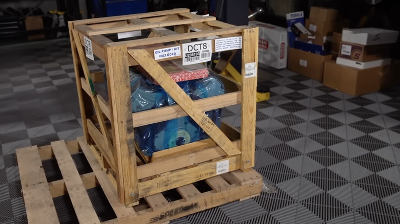 Crate engine in wooden box on wooden pallet