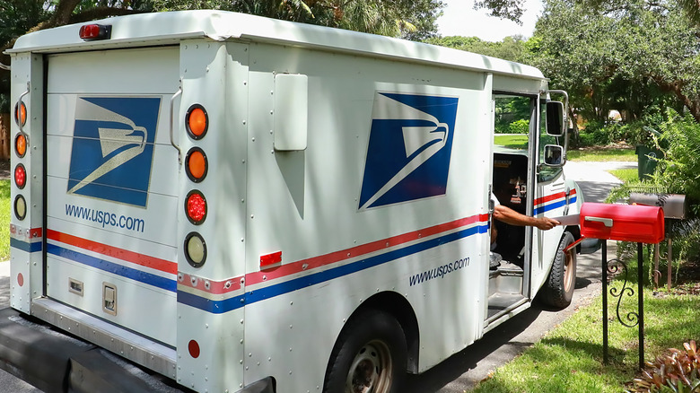 USPS driver delivering mail