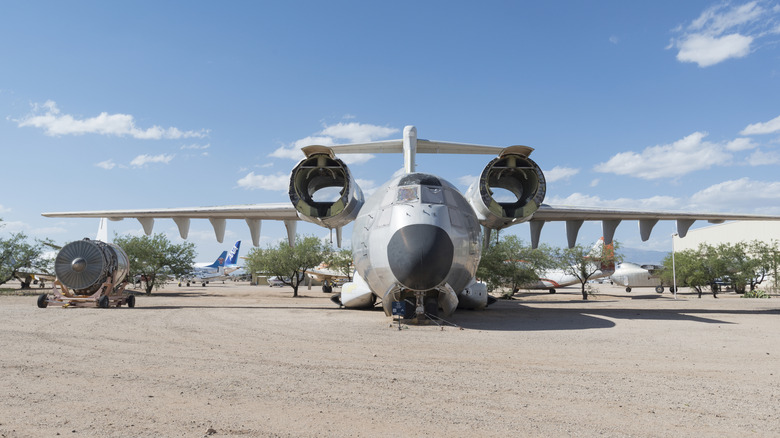 YC-14 plane on the ground with some components separated.