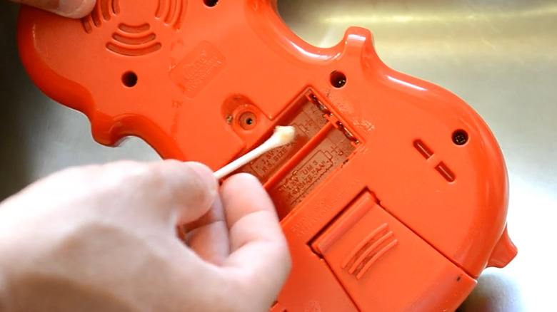 cleaning battery compartment