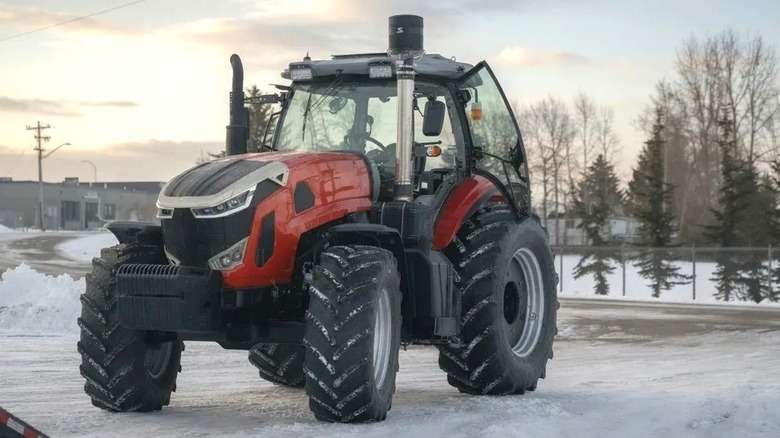 Ursa Ag 260 tractor in red on a snow covered road