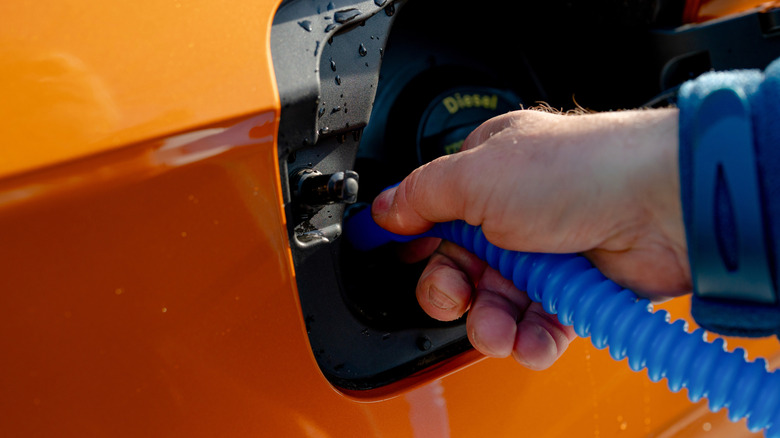 Diesel car filling up diesel exhaust fluid