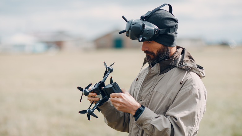 Person checking an FPV drone