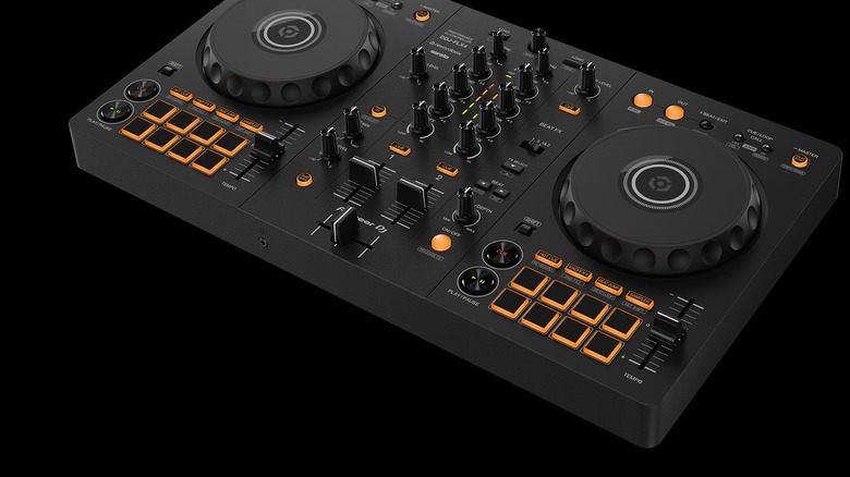 A Pioneer DDJ-FLX4 2-channel DJ controller in black with orange lights.