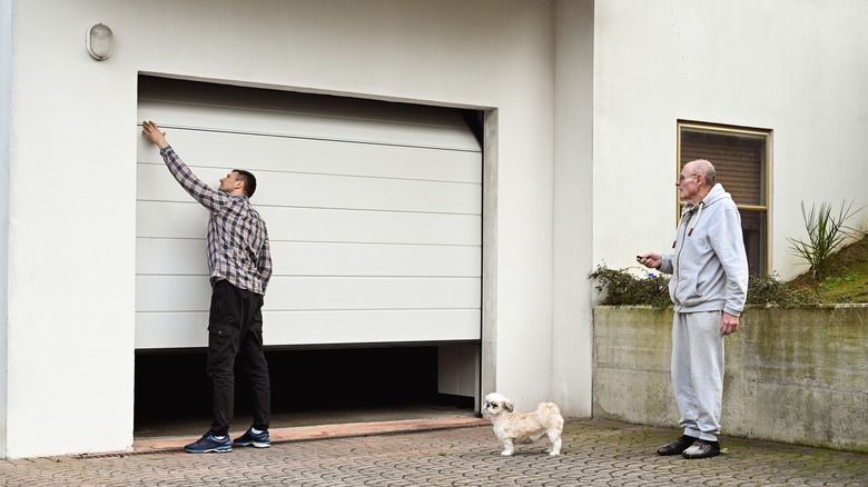 men in front of garage door