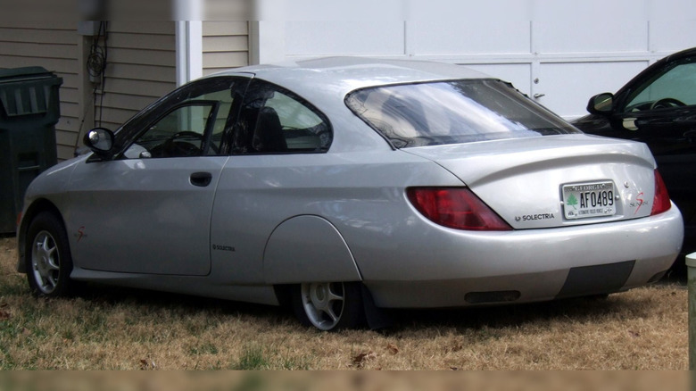 Rear-quarter shot of a silver Solectria Sunrise