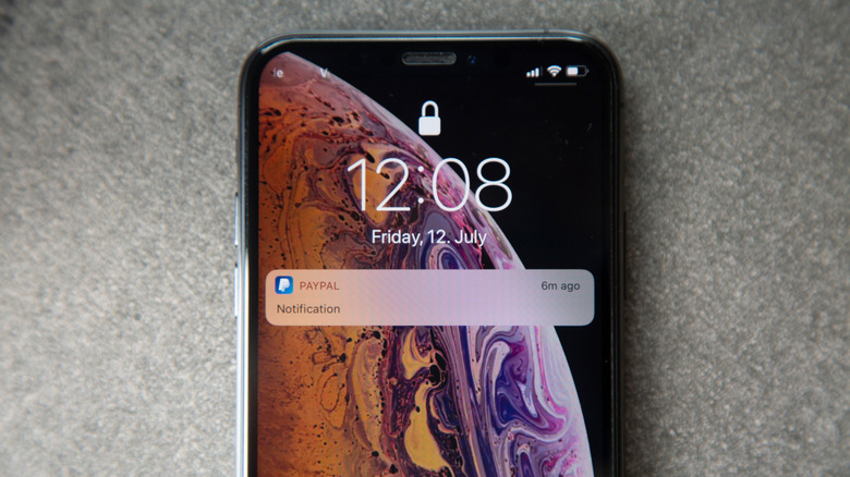 iPhone lockscreen with PayPal notification