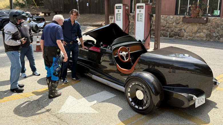 SP40 Restomod roadster being admired by motorcyclists at The Rock Store