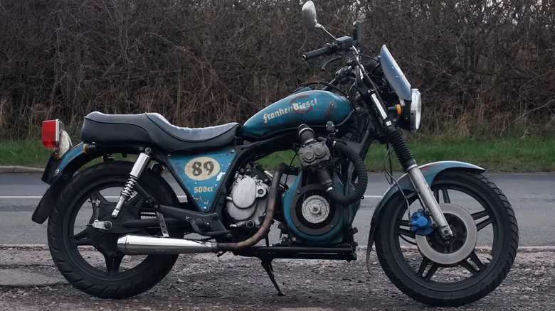 The Frankendiesel motorcycle parked on the side of the road